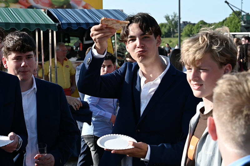 Guests enjoying pizza at an event